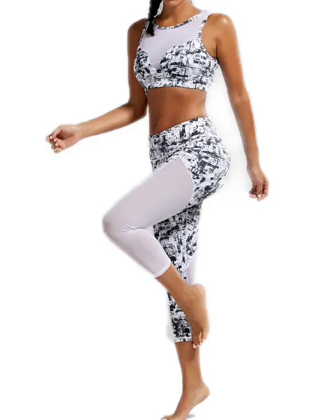 https://www.gymclothes.com/wp-content/uploads/2017/10/sports-padded-bra-and-mesh-panel-sheer-yoga-leggings-usa.jpg.webp